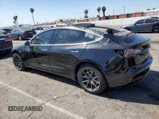 2019 Tesla Model 3 Mid Range z VIN 5YJ3E1EA8KF306096, wystawiony jako Copart lot #54790755 z przebiegiem 170 775 mil mil oraz Szkody całkowita. Historia ofert i sprzedaży dostępna na DreamBid. Obrazek 2.