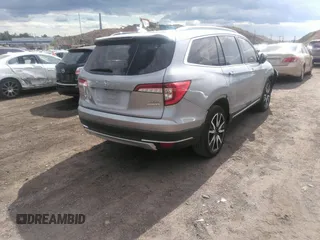 2022 Honda Pilot Touring 7-Passenger with VIN 5FNYF6H60NB013465, listed as a IAAI auction lot 40139627 with 78,161 mi miles. Bid and sale history available at carsss.com. Image 4.