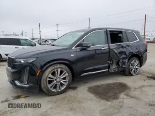 2023 Cadillac XT6 FWD Premium Luxury with VIN 1GYKPCRS5PZ119186, listed as a Copart auction lot 50577175 with 32,189 mi miles and Salvage Title. Bid and sale history available at carsss.com. Image 1.