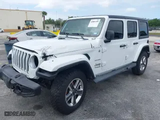 2019 Jeep Wrangler Unlimited Sahara with VIN 1C4HJXEN0KW623325, listed as a IAAI auction lot 42001189 with 1 mi miles. Bid and sale history available at carsss.com. Image 2.