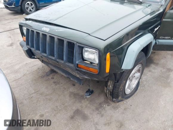 1997 Jeep Cherokee Sport with VIN 1J4FJ68SXVL582060, listed as a IAAI auction lot 41333519 with 183,580 mi miles. Bid and sale history available at carsss.com. Image 12.