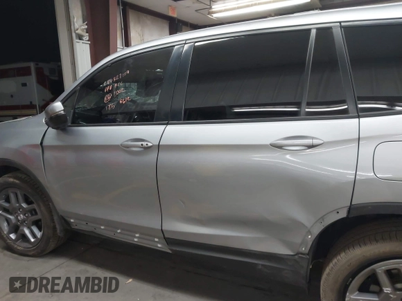 2023 Honda Passport EX-L with VIN 5FNYF8H56PB025612, listed as a IAAI auction lot 41937956 with 31,065 mi miles and . Bid and sale history available at DreamBid. Image 14.