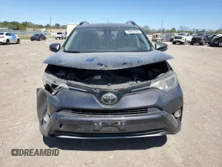 2018 Toyota RAV4 XLE with VIN JTMWFREV3JJ729302, listed as a Copart auction lot 49823765 with 100,576 mi miles and Salvage Title. Bid and sale history available at DreamBid. Image 5.