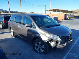 2015 Toyota Sienna LE AAS with VIN 5TDKK3DC3FS529845, listed as a IAAI auction lot 41627102 with 130,334 mi miles. Bid and sale history available at carsss.com. Image 1.