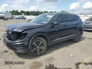 2018 Volkswagen Tiguan SEL with VIN 3VV2B7AX6JM144871, listed as a Copart auction lot 61601875 with 103,894 mi miles and Salvage title. Bid and sale history available at DreamBid. Image 1.