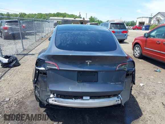 2023 Tesla Model Y Long Range with VIN 7SAYGAEE7PF615751, listed as a IAAI auction lot 42297819 with 31,201 mi miles and . Bid and sale history available at DreamBid. Image 17.