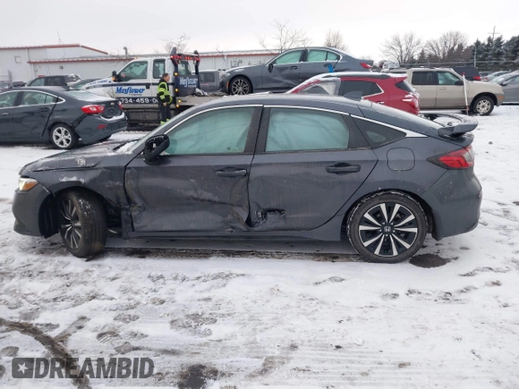 2024 Honda Civic EX-L z VIN 19XFL1H7XRE000407, wystawiony jako IAAI lot #41331186 z przebiegiem 22 764 mil mil oraz . Historia ofert i sprzedaży dostępna na DreamBid. Obrazek 14.