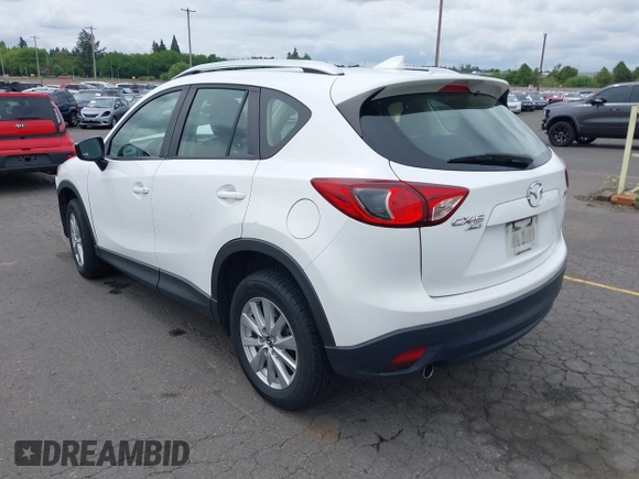 2016 Mazda CX-5 Sport with VIN JM3KE4BY7G0764563, listed as a IAAI auction lot 42279993 with 128,950 mi miles and . Bid and sale history available at DreamBid. Image 3.