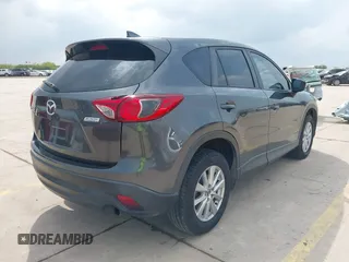 2016 Mazda CX-5 Sport with VIN JM3KE4BY8G0921243, listed as a IAAI auction lot 42102663 with 111,960 mi miles and . Bid and sale history available at DreamBid. Image 4.