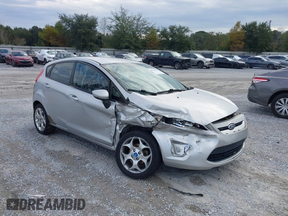 2011 Ford Fiesta SES with VIN 3FADP4FJ5BM232264, listed as a IAAI auction lot 40982622 with 184,726 mi miles. Bid and sale history available at carsss.com. Image 1.