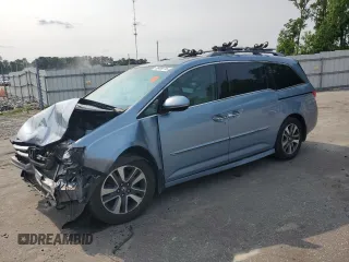 2014 Honda Odyssey Touring with VIN 5FNRL5H95EB080449, listed as a Copart auction lot 58489715 with 154,604 mi miles and Salvage title. Bid and sale history available at DreamBid. Image 1.