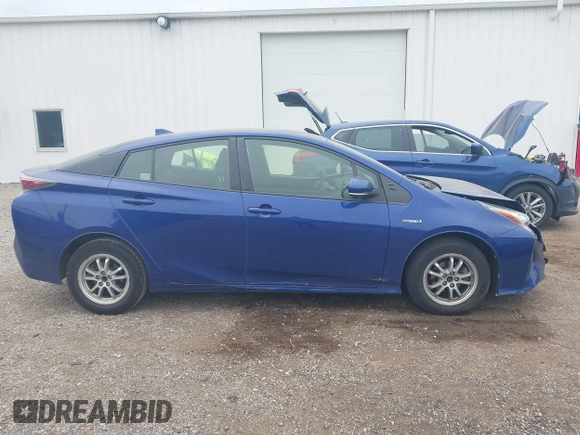 2016 Toyota Prius Two z VIN JTDKBRFU3G3511809, wystawiony jako IAAI lot #42295946 z przebiegiem 118 621 mil mil oraz . Historia ofert i sprzedaży dostępna na DreamBid. Obrazek 13.