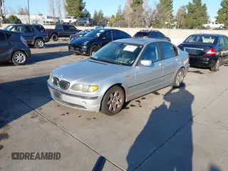 2003 BMW 3 Series 325i with VIN WBAAZ33473PH31756, listed as a IAAI auction lot 41605387 with 187,410 mi miles. Bid and sale history available at carsss.com. Image 2.