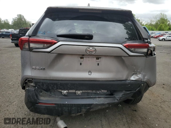 2019 Toyota RAV4 LE with VIN JTMG1RFV4KD004180, listed as a Copart auction lot 57127095 with 71,454 mi miles and Salvage title. Bid and sale history available at DreamBid. Image 6.
