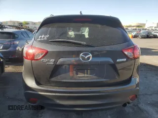 2014 Mazda CX-5 Grand Touring with VIN JM3KE4DY1E0328852, listed as a Copart auction lot 53965265 with 67,242 mi miles and Salvage Title. Bid and sale history available at DreamBid. Image 6.