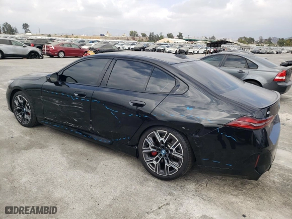 2024 BMW i5 M60 with VIN WBY43FK03RCP92888, listed as a Copart auction lot 76619994 with 10,829 mi miles and Salvage Title. Bid and sale history available at carsss.com. Image 2.