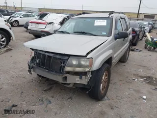2004 Jeep Grand Cherokee Laredo with VIN 1J4GX48S44C301120, listed as a IAAI auction lot 41281556 with 267,246 mi miles. Bid and sale history available at carsss.com. Image 6.