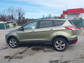 2013 Ford Escape SE with VIN 1FMCU9GX1DUB69236, listed as a IAAI auction lot 41575494 with 122,075 mi miles and . Bid and sale history available at DreamBid. Image 14.