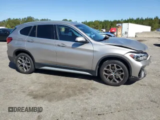 2021 BMW X1 sDrive28i with VIN WBXJG7C0XM5S33884, listed as a Copart auction lot 48413405 with 89,698 mi miles and Salvage Title. Bid and sale history available at DreamBid. Image 4.