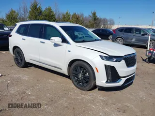 2022 Cadillac XT6 Premium Luxury z VIN 1GYKPCRS2NZ177625, wystawiony jako IAAI lot #41646155 z przebiegiem 94 694 mil mil oraz . Historia ofert i sprzedaży dostępna na DreamBid. Obrazek 1.