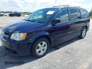 2013 Dodge Grand Caravan SXT with VIN 2C4RDGCG3DR611519, listed as a IAAI auction lot 42237571 with 156,858 mi miles and . Bid and sale history available at DreamBid. Image 2.