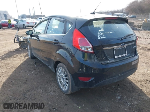2014 Ford Fiesta Titanium z VIN 3FADP4FJXEM127644, wystawiony jako IAAI lot #41555040 z przebiegiem 107 046 mil mil oraz . Historia ofert i sprzedaży dostępna na DreamBid. Obrazek 3.