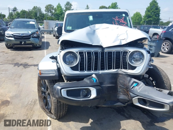 2024 Jeep Wrangler Sahara with VIN 1C4RJXP60RW292136, listed as a IAAI auction lot 42280063 with 26,701 mi miles and . Bid and sale history available at DreamBid. Image 6.
