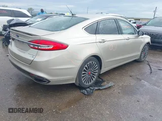 2018 Ford Fusion Titanium with VIN 3FA6P0D9XJR241859, listed as a IAAI auction lot 41893946 with 125,189 mi miles and . Bid and sale history available at DreamBid. Image 4.