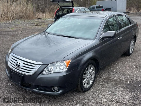 2010 Toyota Avalon XL with VIN 4T1BK3DB5AU353288, listed as a Copart auction lot 56857935 with 233,775 mi miles and Clean Title. Bid and sale history available at DreamBid. Image 2.
