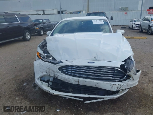 2018 Ford Fusion S z VIN 3FA6P0G71JR166706, wystawiony jako IAAI lot #42275722 z przebiegiem 33 752 mil mil oraz . Historia ofert i sprzedaży dostępna na DreamBid. Obrazek 12.