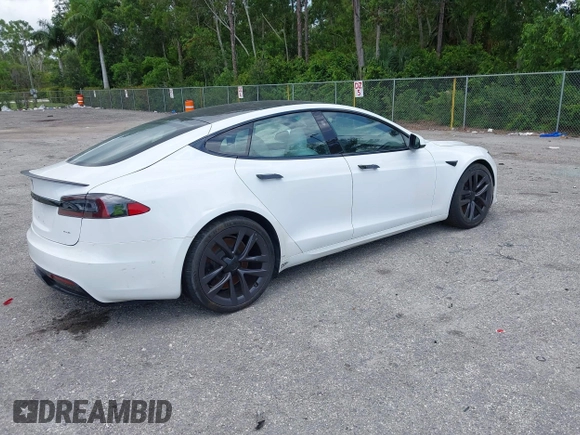 2022 Tesla Model S Plaid with VIN 5YJSA1E61NF460155, listed as a IAAI auction lot 42545167 with 51,711 mi miles and . Bid and sale history available at DreamBid. Image 4.