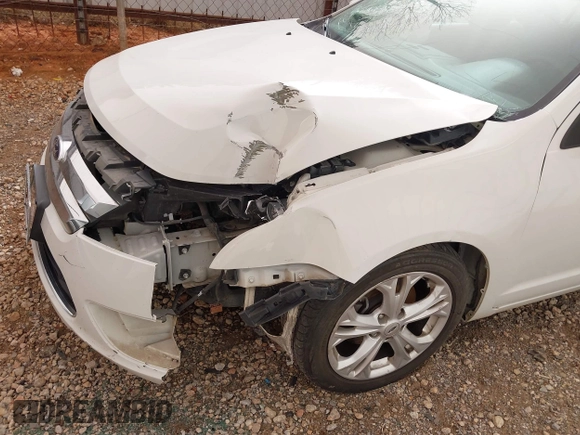 2012 Ford Fusion SE z VIN 3FAHP0HA3CR285217, wystawiony jako IAAI lot #41792353 z przebiegiem 190 916 mil mil oraz . Historia ofert i sprzedaży dostępna na DreamBid. Obrazek 6.
