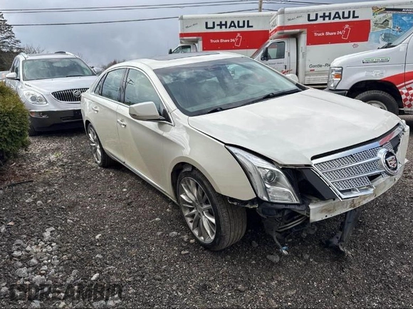 2013 Cadillac XTS Platinum z VIN 2G61V5S33D9173441, wystawiony jako IAAI lot #41902672 z przebiegiem 103 044 mil mil oraz . Historia ofert i sprzedaży dostępna na DreamBid. Obrazek 1.