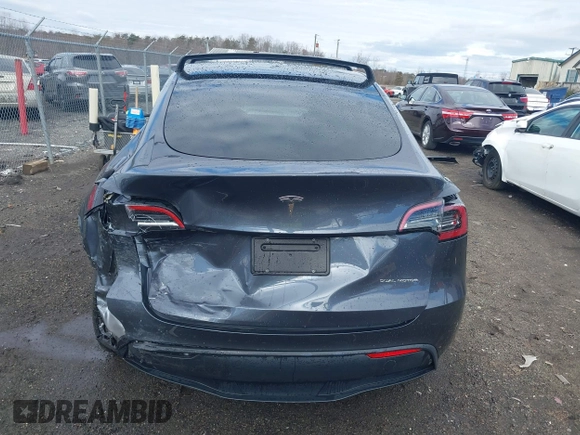 2023 Tesla Model Y Long Range with VIN 7SAYGDEE8PF599254, listed as a IAAI auction lot 41718342 with 24,339 mi miles and . Bid and sale history available at carsss.com. Image 17.