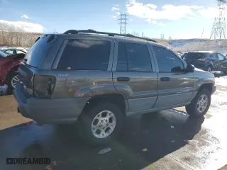 1999 Jeep Grand Cherokee Laredo with VIN 1J4GW58N9XC633464, listed as a Copart auction lot 84682454 with 212,738 mi miles and Salvage Title. Bid and sale history available at carsss.com. Image 3.