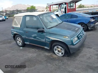 1996 Chevrolet Tracker z VIN 2CNBE1868T6903108, wystawiony jako IAAI lot #42402780 z przebiegiem 109 443 mil mil oraz . Historia ofert i sprzedaży dostępna na DreamBid. Obrazek 1.