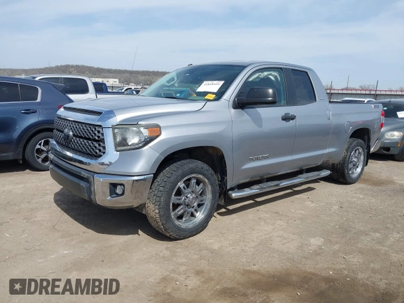 2018 Toyota Tundra 2WD SR with VIN 5TFRM5F16JX133735, listed as a IAAI auction lot 41818455 with 148,456 mi miles. Bid and sale history available at carsss.com. Image 2.