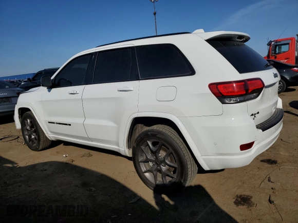 2021 Jeep Grand Cherokee 80th Anniversary with VIN 1C4RJFBG6MC674921, listed as a Copart auction lot 49873555 with 52,668 mi miles and Salvage Title. Bid and sale history available at DreamBid. Image 2.