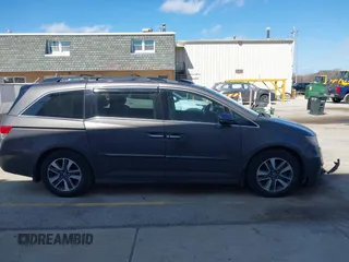 2014 Honda Odyssey Touring with VIN 5FNRL5H97EB101169, listed as a IAAI auction lot 41869233 with 142,147 mi miles and . Bid and sale history available at DreamBid. Image 14.