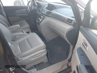 2014 Honda Odyssey Touring with VIN 5FNRL5H90EB080889, listed as a IAAI auction lot 42085305 with 123,286 mi miles and . Bid and sale history available at carsss.com. Image 5.
