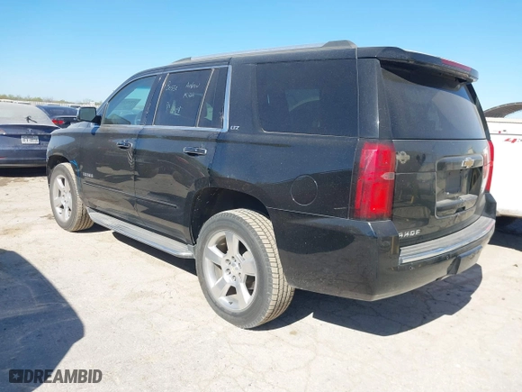 2015 Chevrolet Tahoe LTZ with VIN 1GNSCCKCXFR117525, listed as a IAAI auction lot 41839259 with 143,413 mi miles. Bid and sale history available at carsss.com. Image 3.