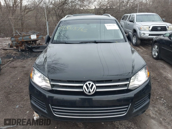 2012 Volkswagen Touareg Sport with VIN WVGFK9BP7CD002243, listed as a IAAI auction lot 41863765 with 136,231 mi miles and . Bid and sale history available at DreamBid. Image 17.