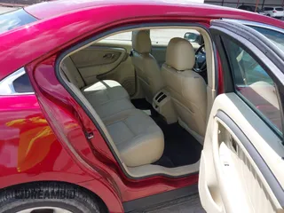 2014 Ford Taurus SEL z VIN 1FAHP2E89EG126922, wystawiony jako IAAI lot #42236235 z przebiegiem 176 917 mil mil oraz . Historia ofert i sprzedaży dostępna na DreamBid. Obrazek 8.