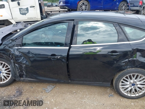 2014 Ford Focus Titanium with VIN 1FADP3N25EL194433, listed as a IAAI auction lot 42512912 with 105,355 mi miles and . Bid and sale history available at DreamBid. Image 14.