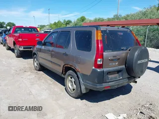 2004 Honda CR-V LX with VIN JHLRD784X4C015401, listed as a IAAI auction lot 39704765 with 158,987 mi miles and . Bid and sale history available at carsss.com. Image 3.