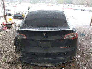 2023 Tesla Model Y Performance with VIN 7SAYGDEF2PF800641, listed as a IAAI auction lot 41612596 with 60,984 mi miles and . Bid and sale history available at DreamBid. Image 16.