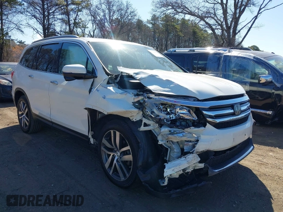 2017 Honda Pilot Touring z VIN 5FNYF6H99HB089121, wystawiony jako IAAI lot #41896878 z przebiegiem 145 330 mil mil oraz . Historia ofert i sprzedaży dostępna na DreamBid. Obrazek 6.