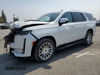 2021 Cadillac Escalade Premium Luxury z VIN 1GYS4BKL4MR215800, wystawiony jako Copart lot #71655614 z przebiegiem 42 844 mil mil oraz Szkody całkowita. Historia ofert i sprzedaży dostępna na DreamBid. Obrazek 1.