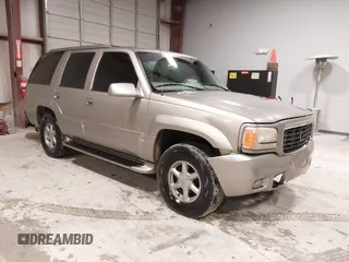 1999 Cadillac Escalade z VIN 1GYEK13RXXR413480, wystawiony jako IAAI lot #41552688 z przebiegiem 214 501 mil mil oraz . Historia ofert i sprzedaży dostępna na DreamBid. Obrazek 1.