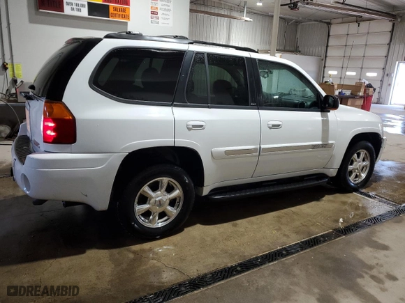 2005 GMC Envoy SLE with VIN 1GKDT13S452315816, listed as a Copart auction lot 52863805 with 128,922 mi miles and Salvage Title. Bid and sale history available at carsss.com. Image 3.
